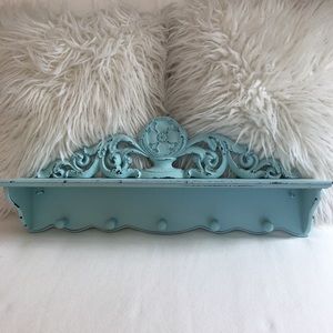 Ornate Blue Shelf with Peg Hooks